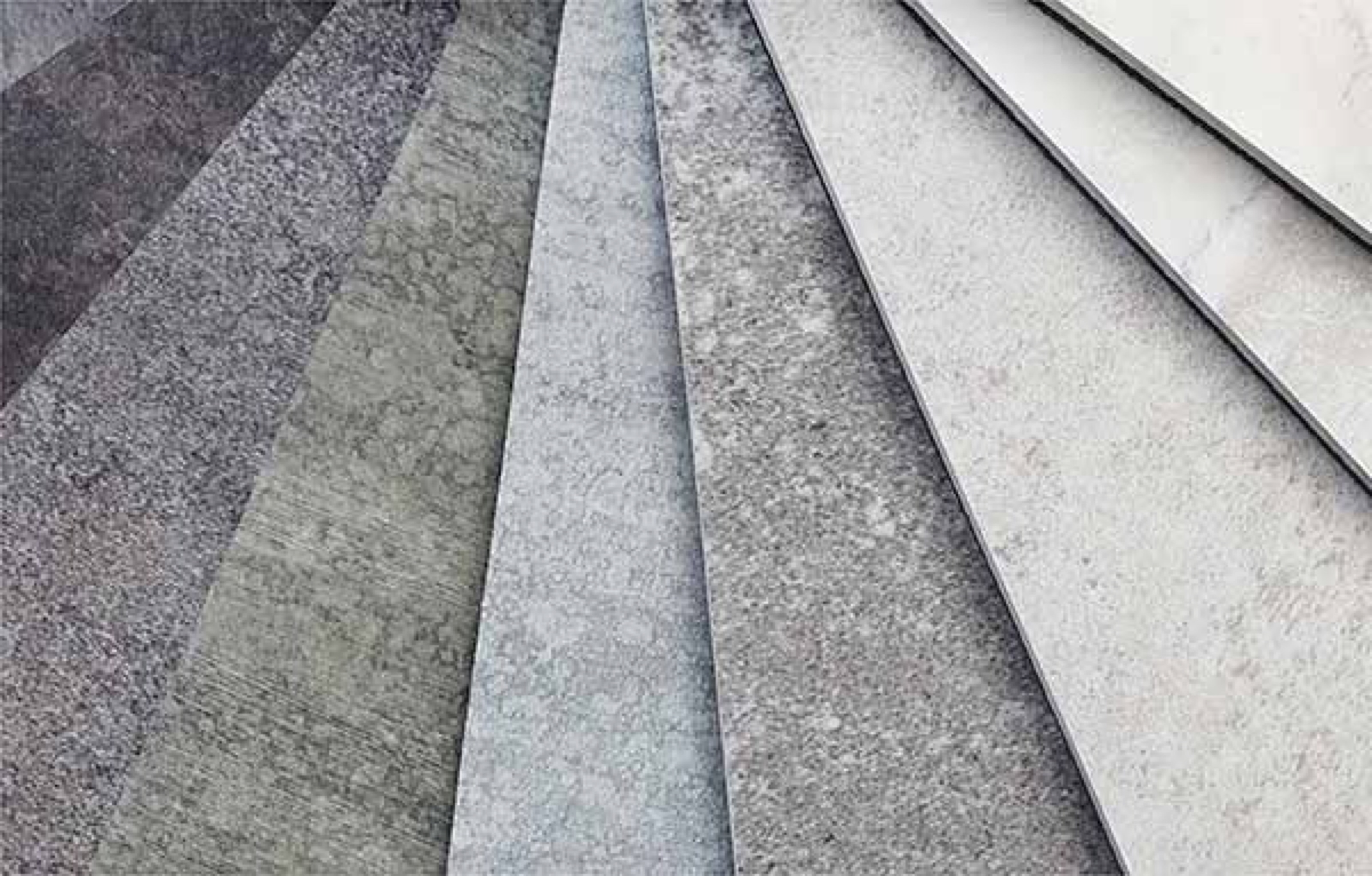 Keramikmuster in Grau und Anthrazit, fächerartig übereinandergelegt, Nahaufnahme